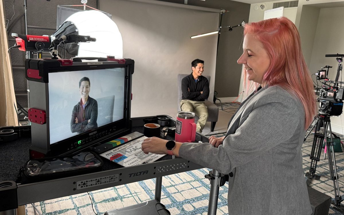 Volare Media producer at the monitor cart during an on-camera interview