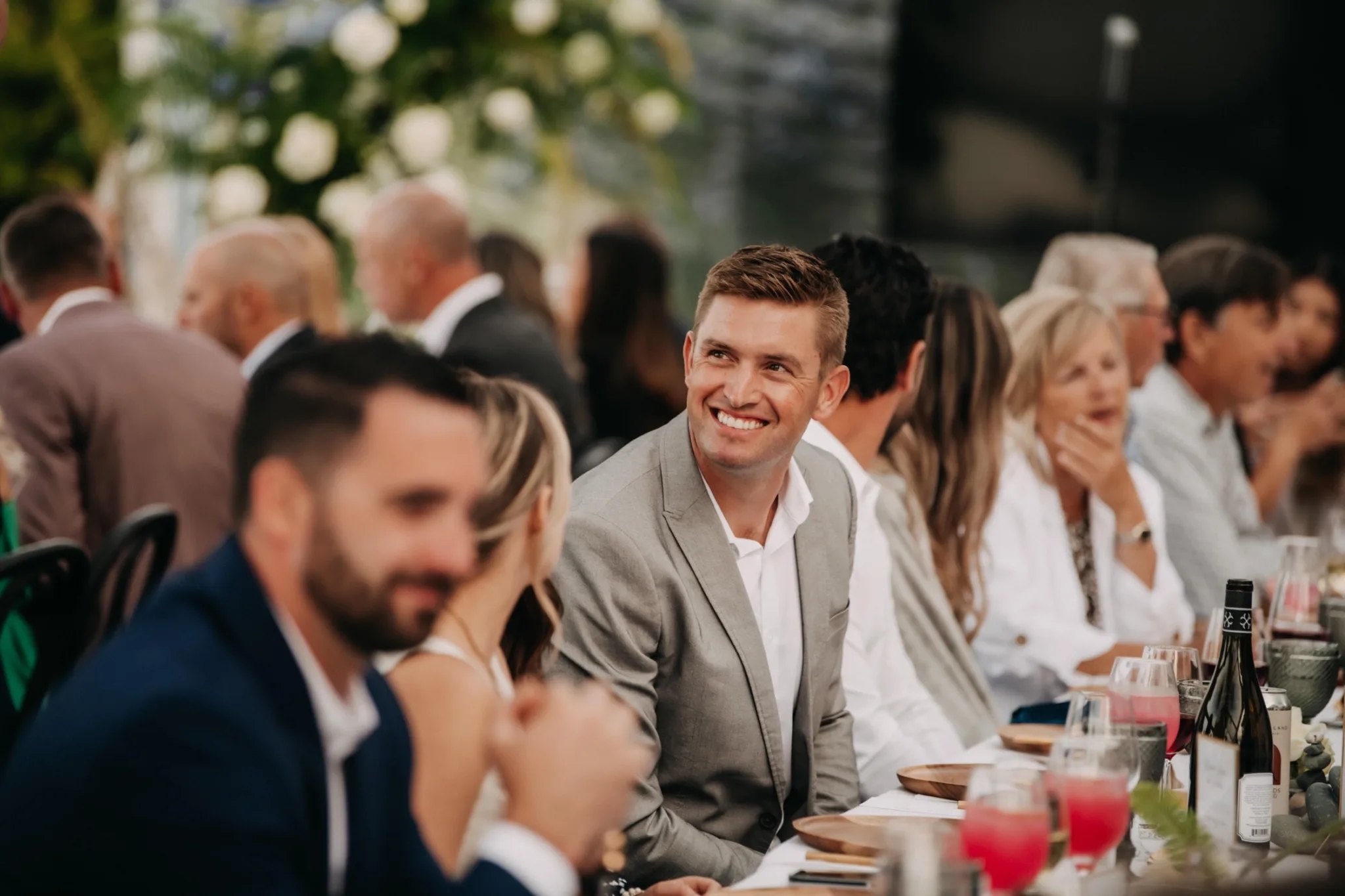 Guests gathered and smiling at a Peninsula Gives fundraising dinner